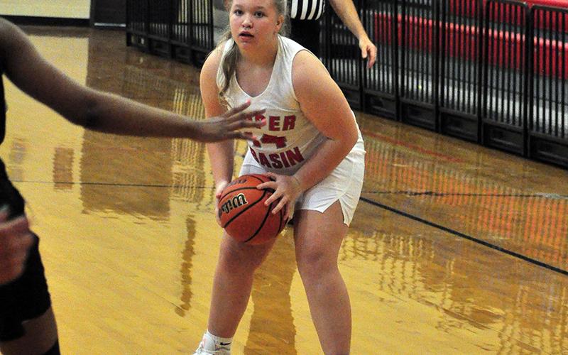 Lady Cougar Raegan Hedden sets a play up to run in recent action for Copper Basin.