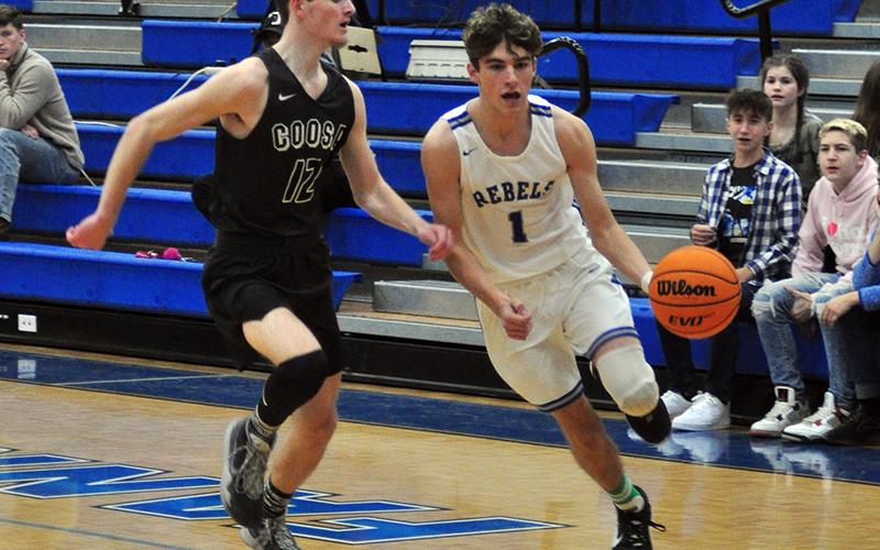 Tucker Hanson drives to the basket for two points in recent action for the Fannin Rebels.