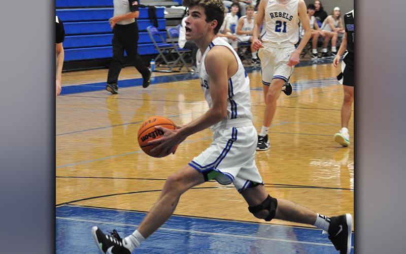 Tucker Hanson drives to the basket on a fastbreak in recent action for the Fannin County Rebels basketball team.
