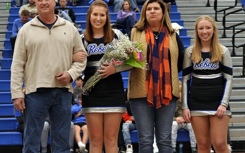 Fannin County High School cheerleading senior Cady Finley was honored along with the other cheer and basketball seniors at FCHS senior night ceremony Friday, January 15. Shown during the ceremony are, from left, father, Philip Finley; Finley; mother, Heather Finley; and Lexi Long.