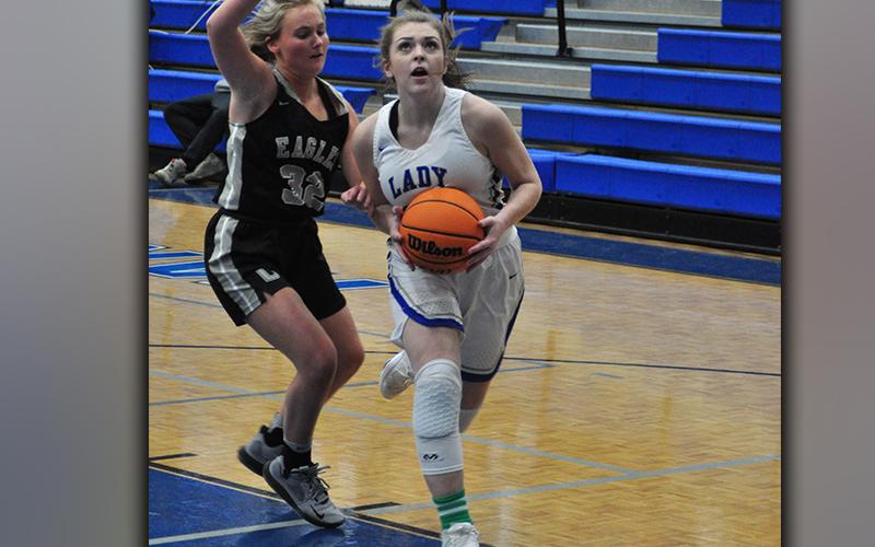 Abby Ledford gets past a Coosa Lady Eagle for a two-point basket during the Lady Rebels 74-21 win over the Lady Eagles Friday, January 22.