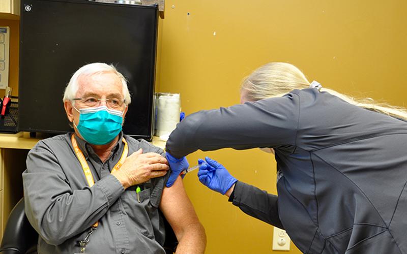 Georgia Mountains Health Chief Executive Officer Steven Miracle couldn’t be more excited to recieve his first dose of the Moderna COVID-19 vaccine Wednesday, December 23. Nurse Kiersten Lanier is shown administering the vaccine.
