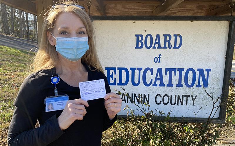 East Fannin Elementary School Nurse Beth Thomas proudly holds her COVID-19 Vaccination Record Card indicating that she’s received the first dose of the Moderna COVID-19 vaccine. “We have both done very well after receiving it,” Thomas said of the vaccine.
