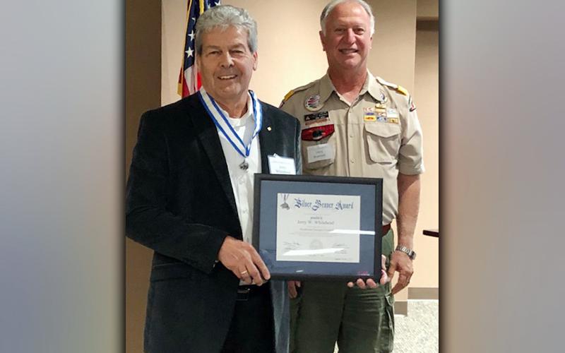 Jerry Whitehead, left, is the recipient of the 2020 Silver Beaver Award. Terry Bramlett, behind, presented the award to Whitehead.