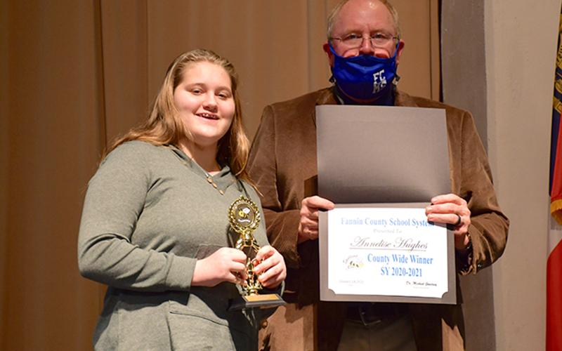 Fannin County Middle School student Annelise Hughes ended the Fannin County School System District Spelling Bee as the winner after spelling the winning word, “Etruscan,” correctly Thursday, January 14. She will now move on to the region level. She is joined by Principal Keith Nuckolls.