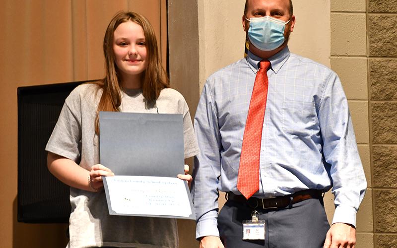 East Fannin Elementary School student Addelyn Barnes made it through several rounds of the Fannin County School System District Spelling Bee and was the first student to become a finalist before becoming the first runner-up Thursday, January 14. She is shown with Principal Matt Price.