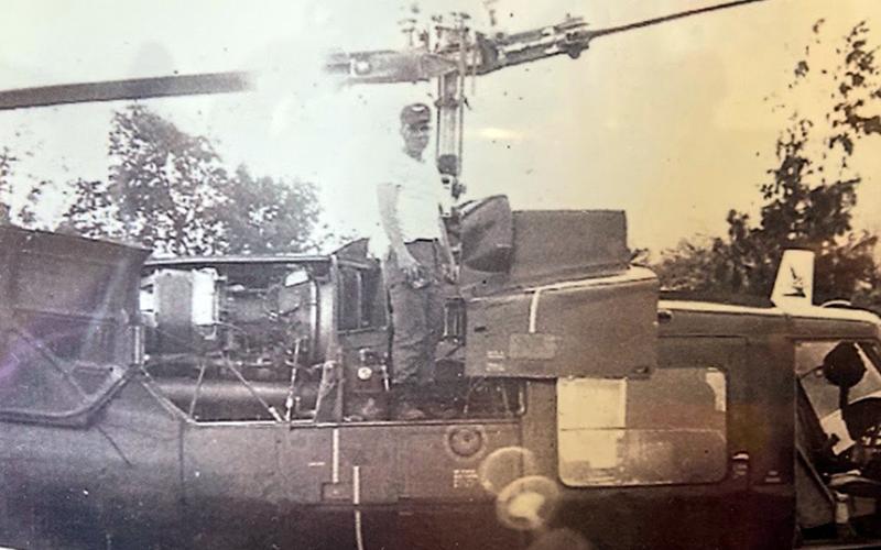 Army veteran Rod McIntyre is shown with one of the many helicopters he worked on during the Vietnam War.