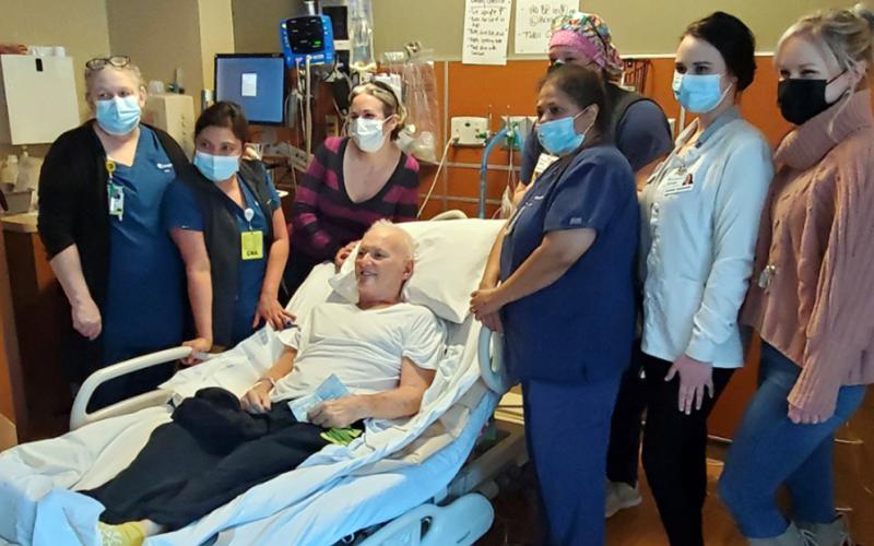 Johnny Scearce was all smiles as he prepared to leave CHI Memorial Hospital in Chattanooga last week. He is surrounded by several members of the hospital team that took care of him. Scearce was moved to an intensive rehab program where he will undergo physical therapy.