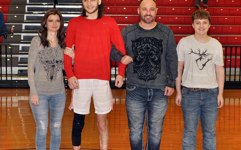 Copper Basin held its senior night ceremony for the basketball and cheer seniors Saturday, February 6. Shown during the ceremony are, from left, mother, Deanne Burkett; senior, Logan Burkett; father, Josh Burkett; and brother Joshua Burkett.