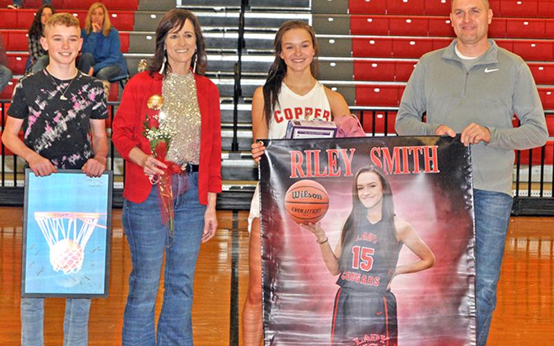 Riley Smith was one of 11 basketball and cheerleading seniors honored at Copper Basin’s senior night ceremony Saturday, February 6. Shown during the ceremony are, from left, brother, Talon Smith; mother, Holly Smith; senior, Smith; and father, Kevin Smith.