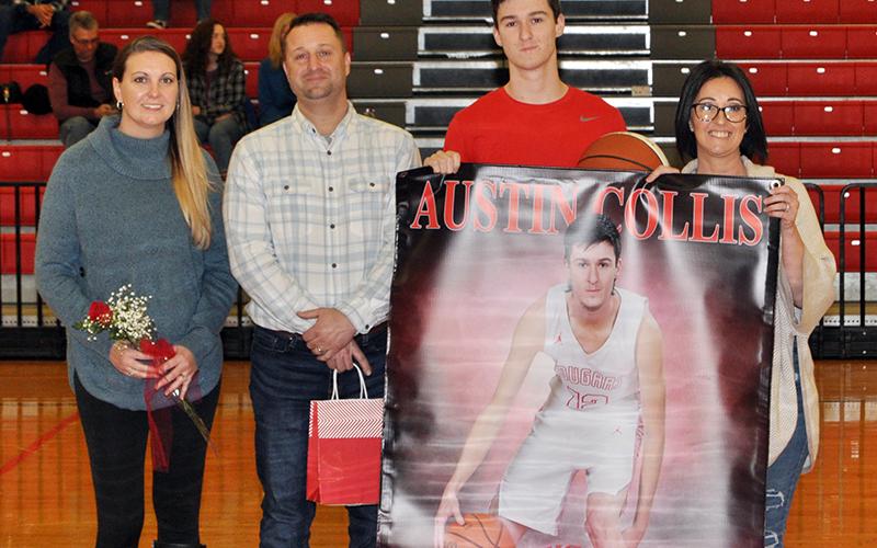 Austin Collis was one of 11 basketball and cheerleading seniors honored at Copper Basin’s senior night ceremony Saturday, February 6. Shown during the ceremony are, from left, stepmother, Laura Collis; father, Jason Collis; senior, Collis; and mother Kristin Kincaid.