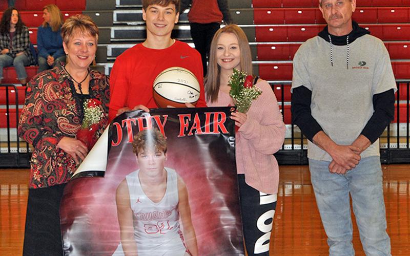 Timothy Fair was honored at Copper Basin’s senior night ceremony Saturday, February 6, along with 10 other basketball and cheerleadind seniors. Shown are, from left, mother, Christine Thomas; senior, Fair; girlfriend, Paige Remlinger; and father Scott Fair.