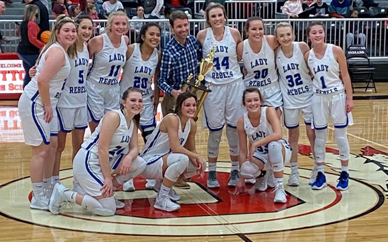 The Lady Rebels basketball team beat out Chattooga Thursday, February 18, to claim the AA Region 7 title. Shown following their championship victory are, from left, front, Abby Ledford, Becca Ledford and Reagan York; and back, Paige Foresman, Reigan O’Neal, Ava Queen, Prisila Bautista, Coach Ryan Chastain, Olivia Sisson, Natalie Thomas, Mackenzie Johnson and Courtney Davis.