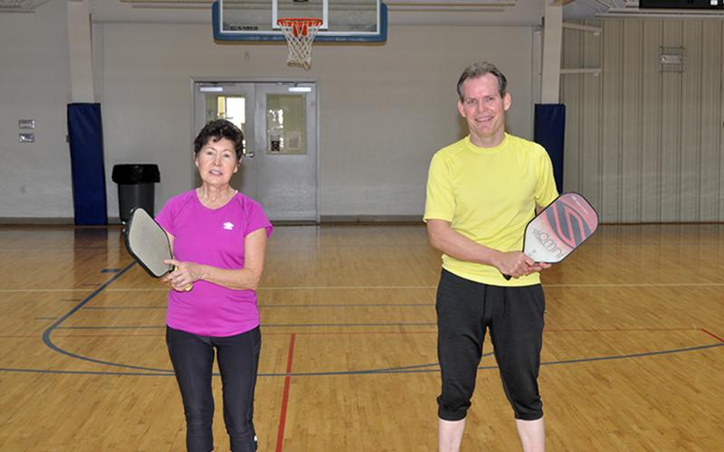 Pickleballers Gail O’Neil, left, and Ray Wallett smile after a game at the Fannin County Recreation Center. There is open pickleball play Monday and Friday from 9 a.m. until 12 p.m.