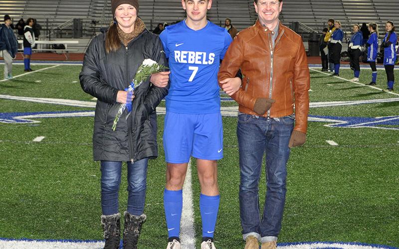 Andrew Harris was one of 14 seniors honored during Fannin’s home soccer game against Gordon Central Friday, February 19. He is shown with his parents, Kathryn Durham and Benjamin Harris.
