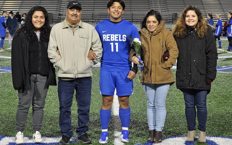 Juan Leal was honored along with 13 other Rebel and Lady Rebel soccer players during Fannin’s home soccer game against Gordon Central Friday, February 19. Leal is shown with his parents Jose and Maria Leal.