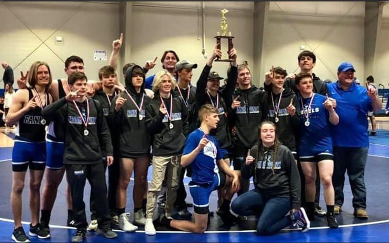 The Fannin County Rebels hoist the Area Championship trophy during their celebration Friday, February 5. This is the first time the Rebels have won an Area Championship since 2005.