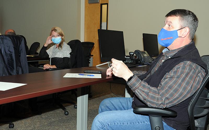 Fannin County Commission Chairman Jamie Hensley raised several questions during an information session at the fire department last week. Listening is Blue Ridge Councilwoman Rhonda Haight.