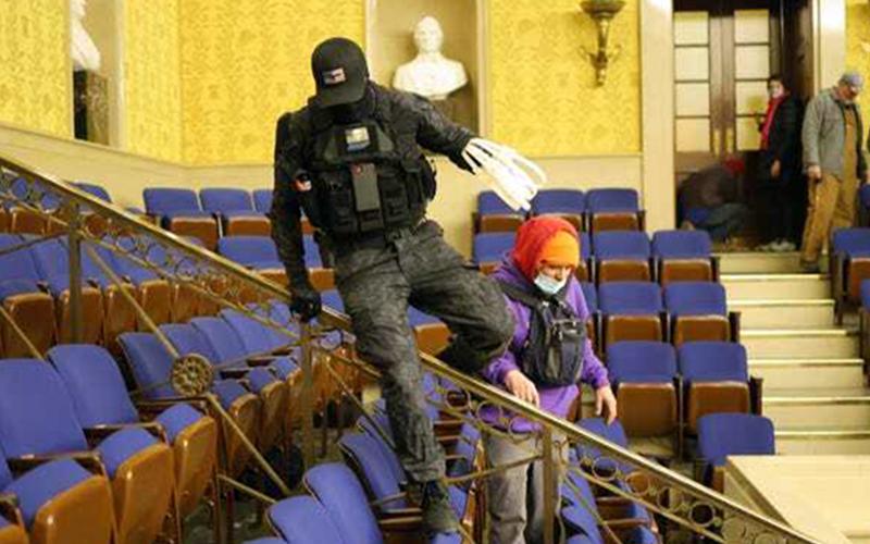 Eric Gavelek Munchel is allegedly shown in this picture during the invasion of the Capitol.