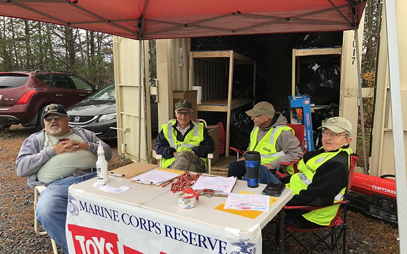 Members of the local Marine Corps League detachment work hard year-round to collect and distribute toys to various organizations and children in the community. Shown working Toys for Tots distribution are, from left, Greg Coffone, Dick Evelyn, Curt Jarrett and Jim Brumbelow.