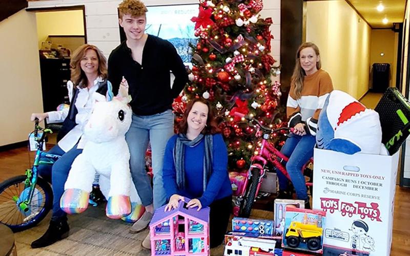 Harry Norman Realty collected and donated a variety of toys to the Marine Corps League’s annual Toys for Tots campaign this past holiday season. Shown are, from left, Joanne Wiley, Logan Fitts, Heather Gerald and Stephanie Cox.
