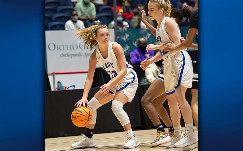 Reagan York (33) looks for an opening with help from Fannin County’s Mackenzie Johnson (32) during the AA Girls State Basketball Championship game in Macon.