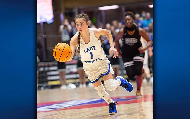 Freshman Courtney Davis brings the ball up the floor for the Lady Rebels during the state championship game against Josey High School Thursday, March 11.