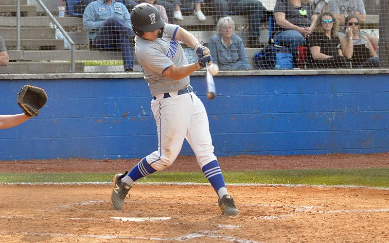 Chance Stacy connects with a Dade County pitch during the Rebels' region game against the Wolverines Wednesday, March 24.