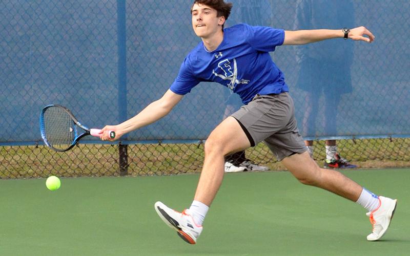 Jake Jones stretches out to keep a volley alive in recent action at a Fannin Rebel tennis match.