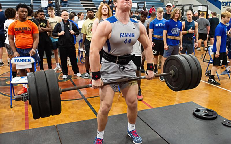 Fannin senior Micah O’Neal pulls a massive dead-lift in a recent weight lifting competition. O’Neal recently won the AA State Championship for weight lifting in the 225-pound classification.