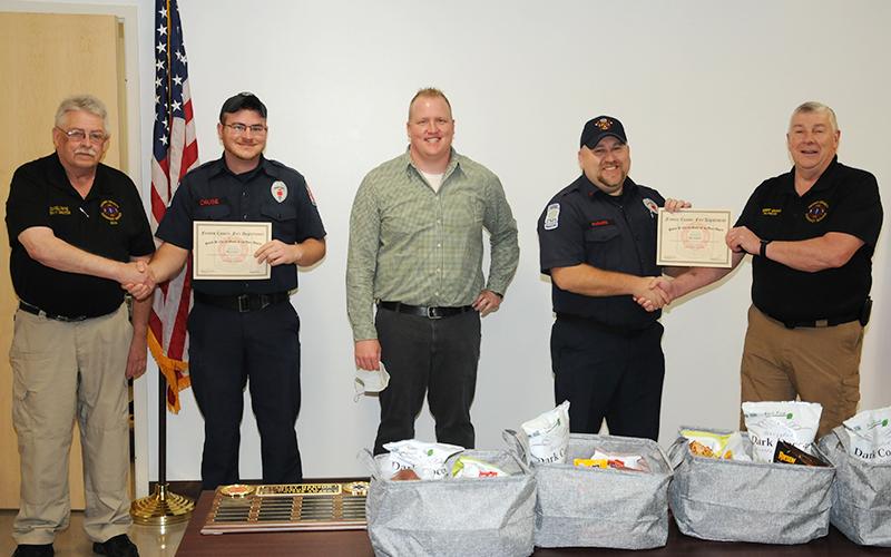 Mason Cruse and Ryan McDais were presented the "David W. Curtis Memorial Medic Award" for saving the lives of two stabbing victims. Shown during the presentation of the award were, from left, EMA Deputy Director Darrell Payne, Cruse, Curtis' son Josh Curtis, McDaris, and EMA Director Robert Graham.