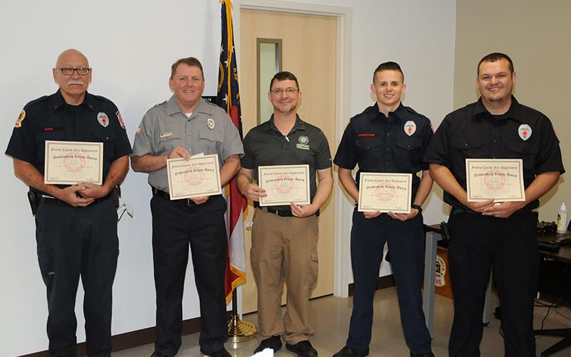 Rob Ross, Kevin Panter, Hugh Rogers, Channing Johnstone and Bradley Beaver, from left, received Outstanding Rescue Awards for their parts in saving the lives of two stabbing victims. It was that same incident that resulted in the "David W. Curtis Memorial Medic Award" for Mason Cruse and Ryan McDaris.