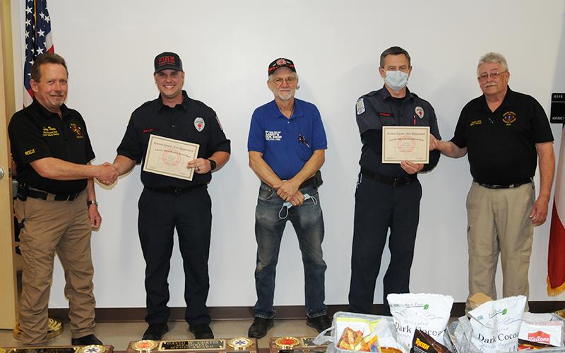 Tim Grant and Randy Epperson received the "Lawrence Waters Rescue Award" for saving a mother and her child who were trapped in their kayak by the waters of the Toccoa River. Shown during the presentation are, from left, Fire Chief Larry Thomas, Grant, Lawrence Waters' son Larry, Epperson, and EMA Deputy Director Darrell Payne.