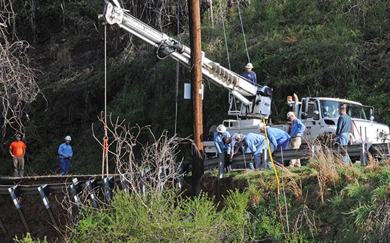 Tri-State EMC crews are busy this morning (Friday, March 26, 10 a.m.) working to stabilize the power pole in the area where a washout on Bullen Gap Road in Blue Ridge destroyed a city water line.