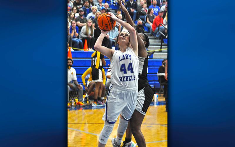 Fannin County’s Abby Ledford gets by a Butler defender on the way to two of her 8 points in the Final Four game at Fannin County High School Saturday night.