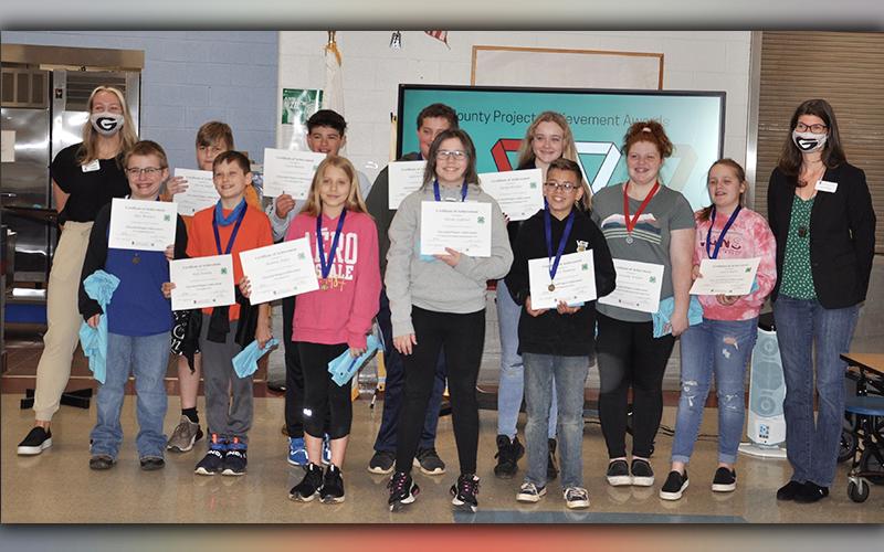 4-H Project Achievement Awards were presented to Blue Ridge Elementary School fourth and fifth grade students Tuesday, March 23. Awards were given in a variety of categories from sports to agriculture. Fifth grade students award winners shown are, from left, front, Alex McClure, Kole Stanley, Shianne Baker, Tatum Ledford, and Tanner Ramsey; back, University of Georgia Extension AmeriCorp Volunteer Rachel Wasserman, Avrey Angel, Casen Bailey, Gabriel Partin, Jaelyn Breaux, Cassidy Walden, Cason Roper and Fan