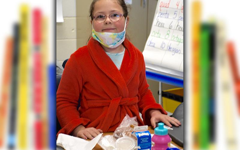 East Fannin Elementary School student Autumn Karry celebrates Pajama Day in her snazzy red robe Wednesday, March 3.