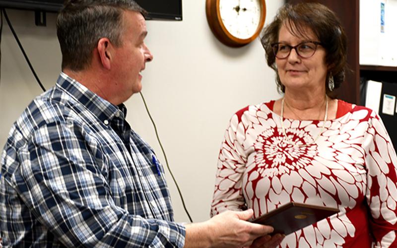 Fannin County Board of Commissioners’ Chairman Jamie Hensley presented Chief Land Development Officer Marie Woody with a plaque honoring her 40 years of the service to the county Tuesday, March 9.