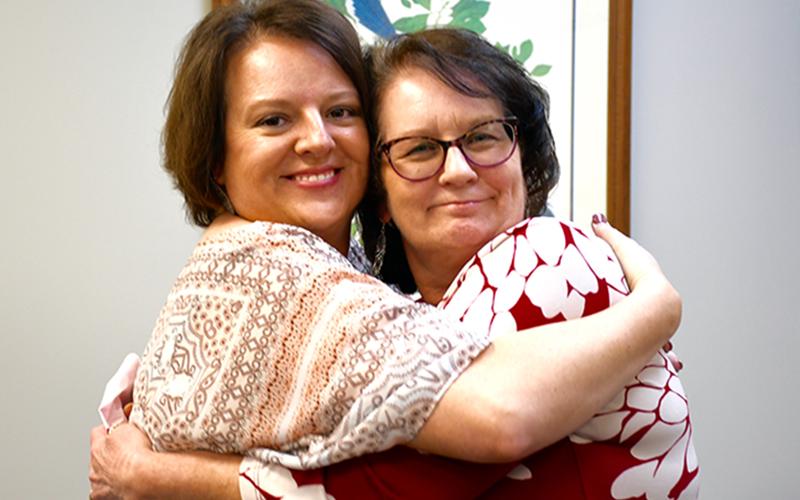 RIGHT: Fannin County Chief Tax Appraiser Dawn Cochran, left, celebrated her friend and co-worker Chief Land Development Officer Marie Woody’s 40 years of service to the county with a big hug.