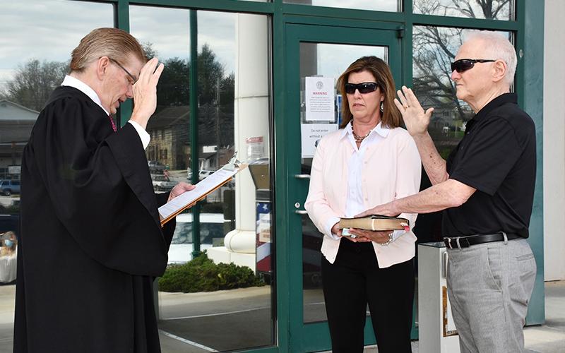 Johnny Scearce is officially Fannin County’s Post One Commissioner following his swearing-in ceremony on the front steps of the Fannin County Courthouse Friday, March 26. He is shown with his wife, Brenda, and Probate Court Judge Scott Kiker.