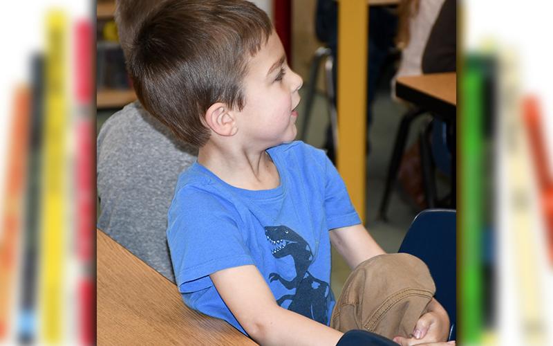 West Fannin Elementary School student Alex Marquez is on the edge of his seat as he hears another tale from Dr. Seuss during Read Across America Week Tuesday, March 2.