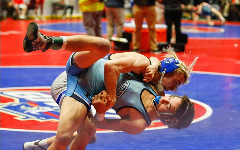 Blake Summers throws Lovett wrestler Alex Hyman to the mat during his state championship match, Wednesday, February 10.