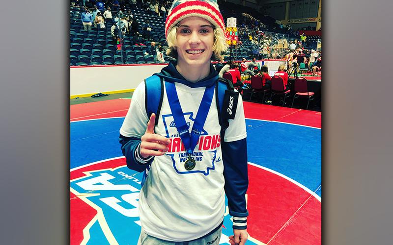 Blake Summers is all smiles as he shows off his medal after he won the state title. Summers is the first freshman to win a wrestling state title at Fannin County High School.