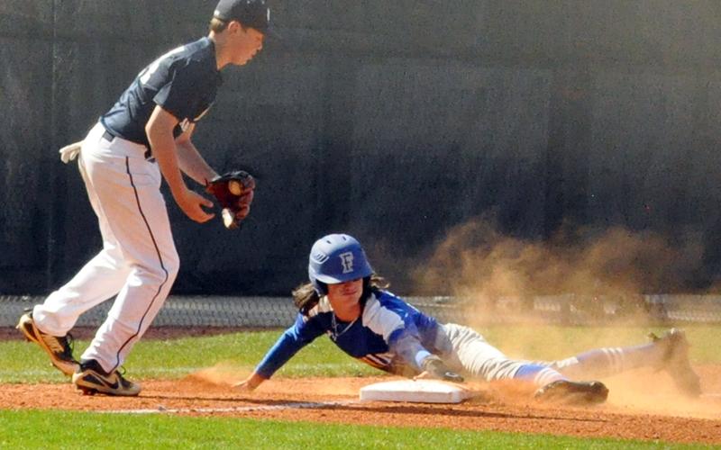 Colton Gray slides into third and later goes on to score in Fannin County Middle School’s baseball region championship against White County Tuesday, March 30.