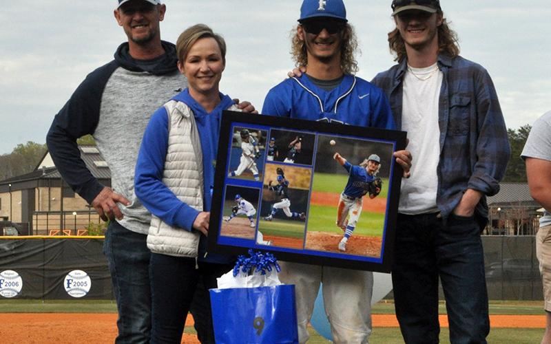 Fannin County baseball honored Wyatt Rogers along with seven other seniors at the Rebels senior night ceremony Friday, April 23. Shown are, from left, Buddy Rogers, father; Christine Rogers, mother; senior, Wyatt Rogers; and Garrett Rogers, brother.