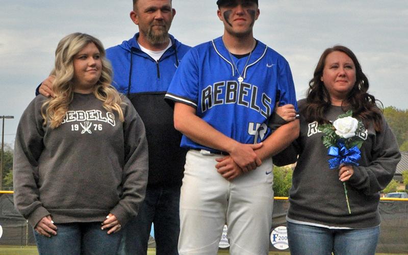 The Fannin County Rebels baseball team celebrated seven senior Rebels between games against Chattooga Friday, April 23. Shown during the ceremony are, from left, Tori Hughes, sister; Dusty Hughes, father; senior, Logan Hughes; and Crystal Hughes, mother