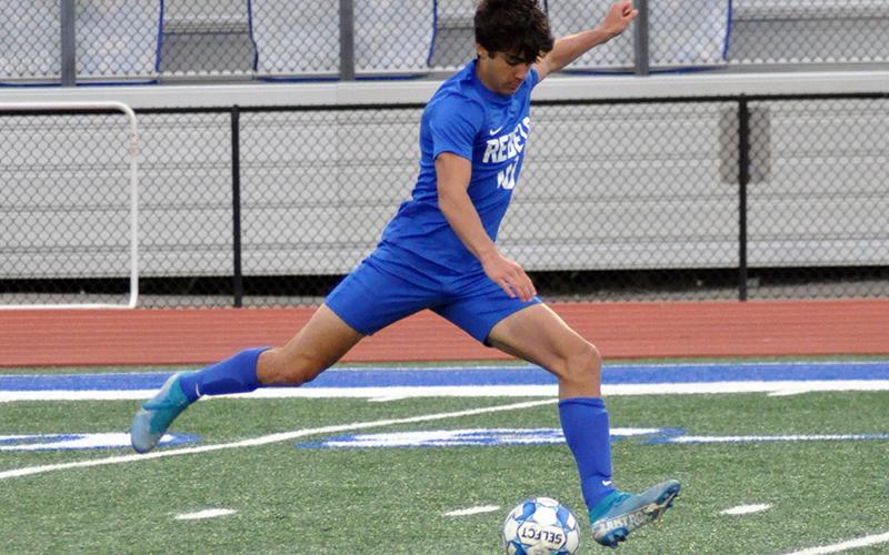 Hayden Lynch unloads on a kick during the Rebels game against Pepperell Friday, April 16.