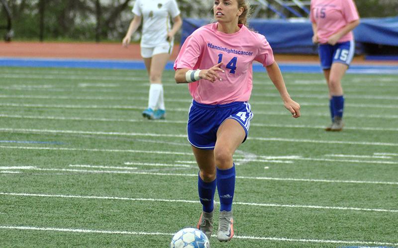 Kinsley Sullivan pushes the ball up the field for the Lady Rebels soccer team in their game against Pepperell Friday, April 16.