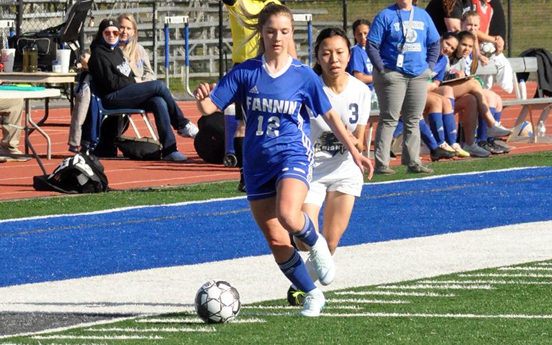 Hannah Sosebee pushed the ball up the field during the Lady Rebels game with the Elite Scholars Academy Thursday, April 22. Sosebee had one goal in the game.