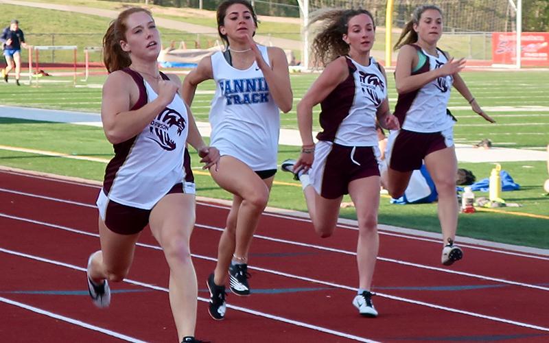 Monica Cosentino, second from left, is shown competing the 200 Meter Dash in recent action for the Lady Rebels.